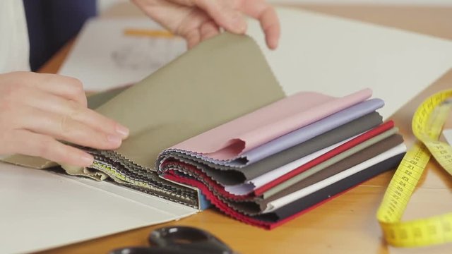 Woman selects tissue samples on a close-up table