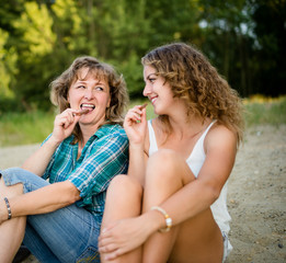 Mother and daughter enjoying chocolate bar