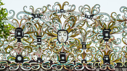 Dayak (indigenous people of Borneo) traditional wood sculpture as welcoming sign for entrance of the village