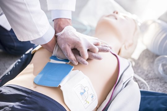 Doctor undertaking CPR training