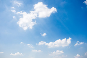 Naklejka na ściany i meble Group of clouds in the blue sky background.