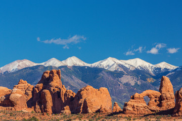 Summer scenery in Arches National Park, Utah, with red rock formations and clear blue sky