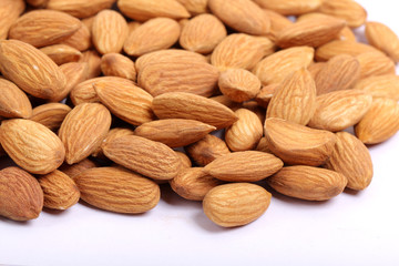 Almonds isolated. Group of almond nuts isolated on white background. Full depth of field