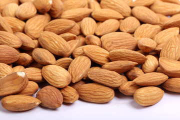 Almonds isolated. Group of almond nuts isolated on white background. Full depth of field