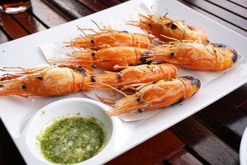 close up shrimp grilled on white plate