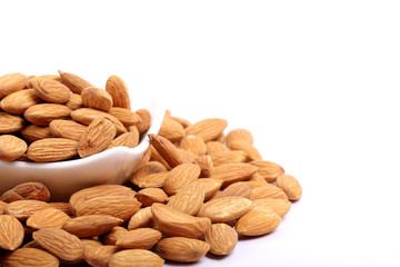 Almonds isolated. Group of almond nuts isolated on white background. Full depth of field
