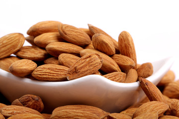 Almonds isolated. Group of almond nuts isolated on white background. Full depth of field