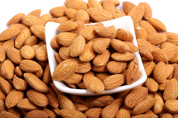 Almonds isolated. Group of almond nuts isolated on white background. Full depth of field