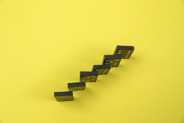 Dominoes on a yellow background