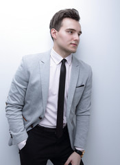 closeup of a young man in a business suit.