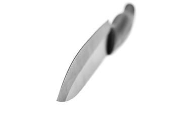 Black kitchen knife on white background. Close up.