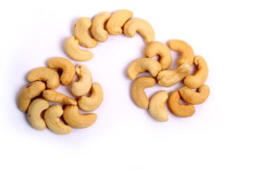 Unshelled roasted and salted cashew nuts isolated on white background
