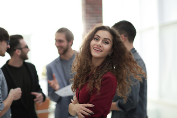 young business woman on the background of the employees.