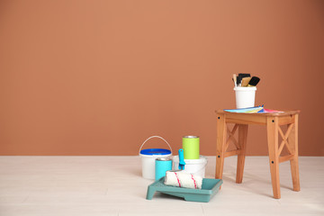 Decorator's tools near color wall