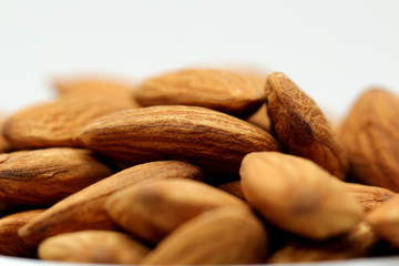 Almonds isolated. Group of almond nuts isolated on white background. Full depth of field