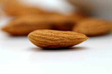 Almonds isolated. Group of almond nuts isolated on white background. Full depth of field