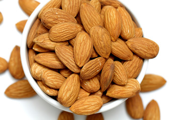 Almonds isolated. Group of almond nuts isolated on white background. Full depth of field