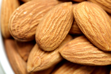 Almonds isolated. Group of almond nuts isolated on white background. Full depth of field