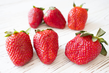fresh strawberry on white wooden table. Top view point.