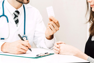 Doctor holding pill with patient  in hospital.healthcare and medicine