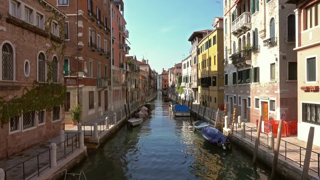 Multi-colored houses on canal in Venice, Italy, 4k