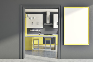Gray wall kitchen, yellow counters, poster, door