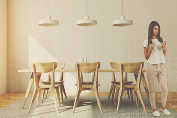 Woman in a luxury dining room