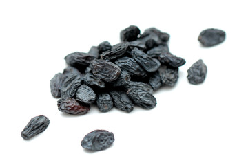 black raisins on white background