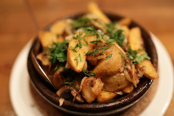 Fried potatoes with mushrooms