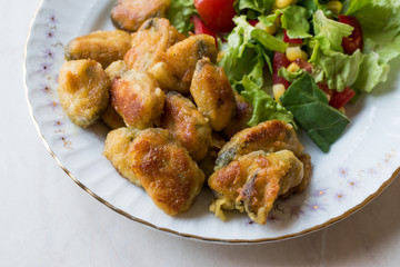 Fried Crispy Mussels Served with Salad.