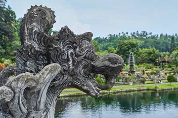 Scary mythology statue in Tirta Gangga water palace on Bali island, Indonesia