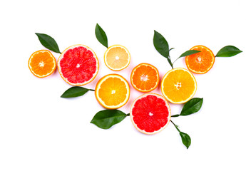 Citrus fruits isolated on white background. Isolated citrus fruits. Pieces of lemon, pink grapefruit and orange isolated on white background, with clipping path. Top view