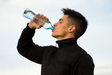 young man drinking water