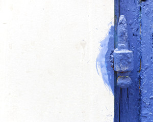 white board and blue painted old hinge