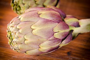Italian artichokes on wooden plane