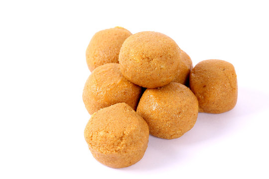 Besan Laddoo - Roasted gram flour mixed with Desi Ghee and sugar to make tasty and round shape sweet Laddu. selective focus