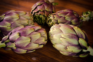 Italian artichokes on wooden plane