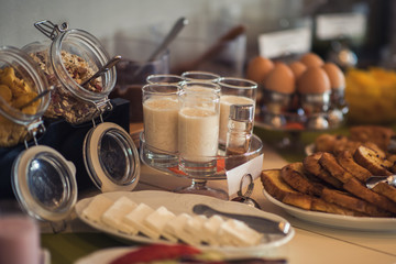 Fresh and bright continental breakfast table with jam. Table settings