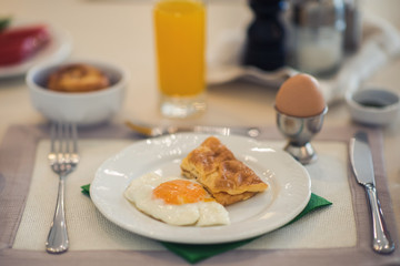 Breakfast from an omelet of dried fruits and juice on the table