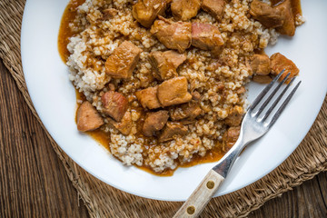 Barley groats with stewed meat.