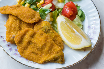 Fried Crispy Sardine Fish Plate with Salad and Lemon / Seafood Sardalya