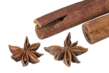 Cinnamon sticks and star anise close up. Decorative detail of aromatic Christmas seasonings. Isolated on white background. Great depth of field.