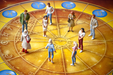people figures standing on horoscope with zodiac signs like a concept astrology and people 