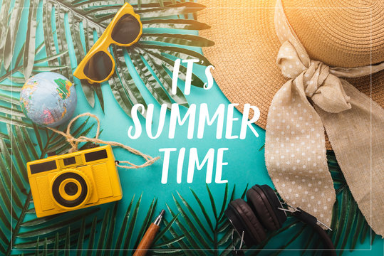 flat lay frame border of summer concept with travel stuff camera notebook glasses and woman hat flatlay image on color background with free copy space
