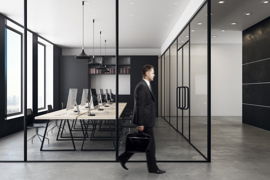 Businessman in contemporary coworking office interior