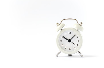 Classic bell alarm clock on white background with copy space