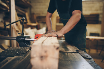 Master carpenter working in his woodwork or workshop. 