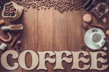 cup of coffee and letters on wood