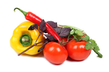 Tomatoes and peppers on white background