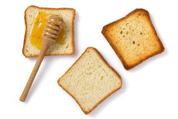honey and bread on white